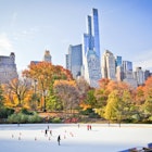 Ice skaters having fun in New York Central Park in fall